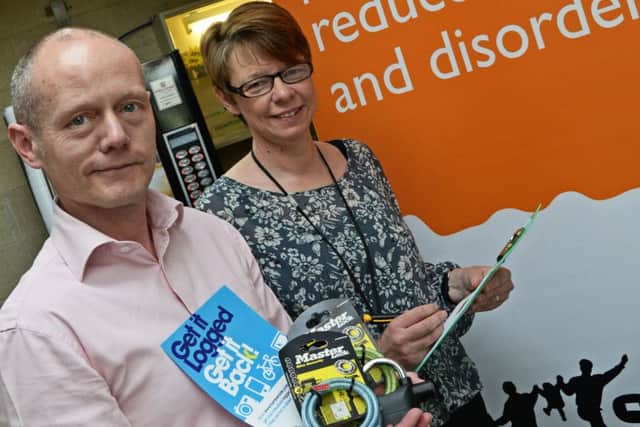Nicola Latham, Safer Neighbourhoods Officer, pictured with Andy Crewe, during an immobile safety event at Epworth Leisure Centre. Picture: Marie Caley NEPB 05-05-15 Immobile Safety MC 3