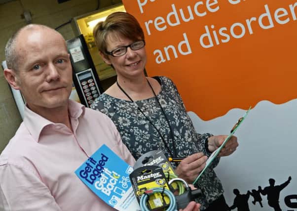 Nicola Latham, Safer Neighbourhoods Officer, pictured with Andy Crewe, during an immobile safety event at Epworth Leisure Centre. Picture: Marie Caley NEPB 05-05-15 Immobile Safety MC 3