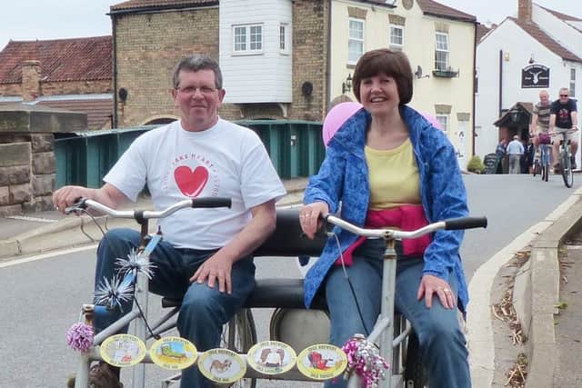 Side by side on a bike made for two are Pete and Lesley Riley in West Stockwith. Picture: Trevor Halstead