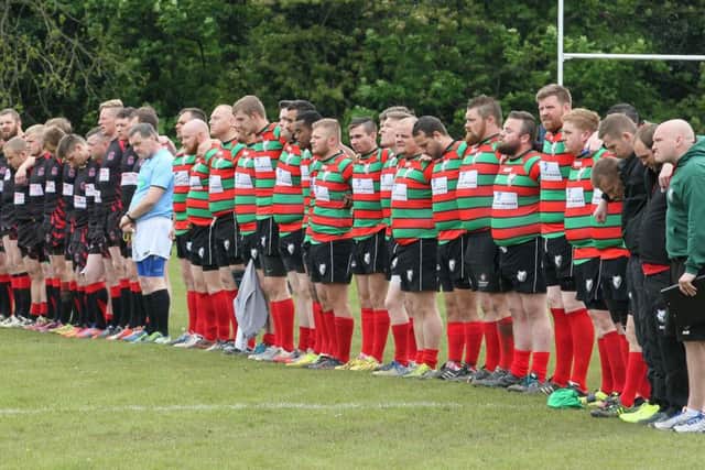 The players from both sides stand for a minutes silence in respect of Danny Jones -Pic by: Richard Parkes