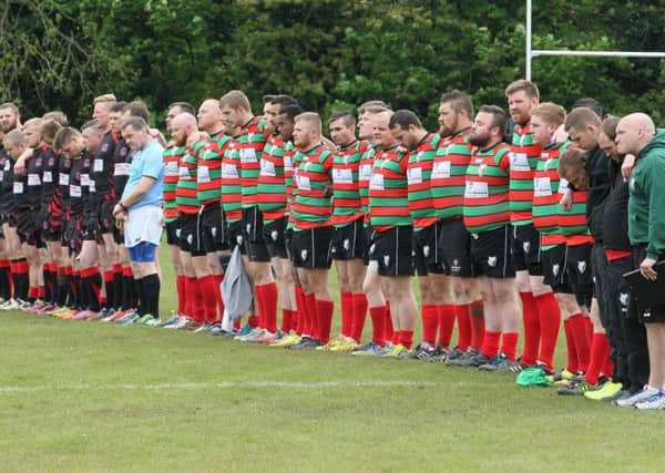 The players from both sides stand for a minutes silence in respect of Danny Jones -Pic by: Richard Parkes