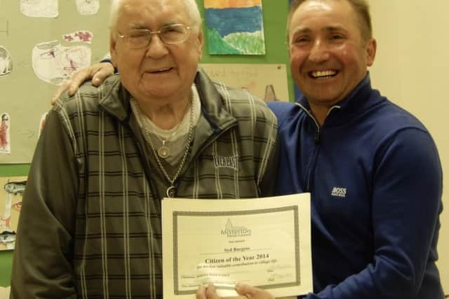 Sid Burgess receives his Misterton Citizen of the Year Award from Coun Wayne Howe