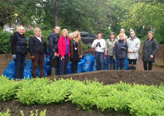 Staff at Browns working on Whittons Gardens.