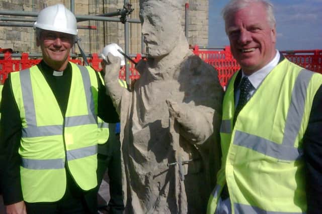 The Very Revd Philip Buckler, Dean, with Sir Edward Leigh MP, a member of the Cathedral Council, atop Lincoln Cathedral in 2011.