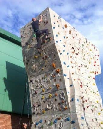 Alison Noble and Paul Alexander practicing for their climbing challenge