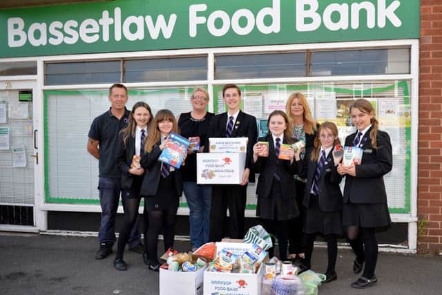 Students of Outwood Academy Valley present food donations they have collected in school to Alison Palmer, pictured are Mr Peace and Mrs Hind with students Oliver Spacey, Jade Gordon, Natalie Franklin, Chontelle Sandford, Katie Holloway and Imogen Galloway-Dutton