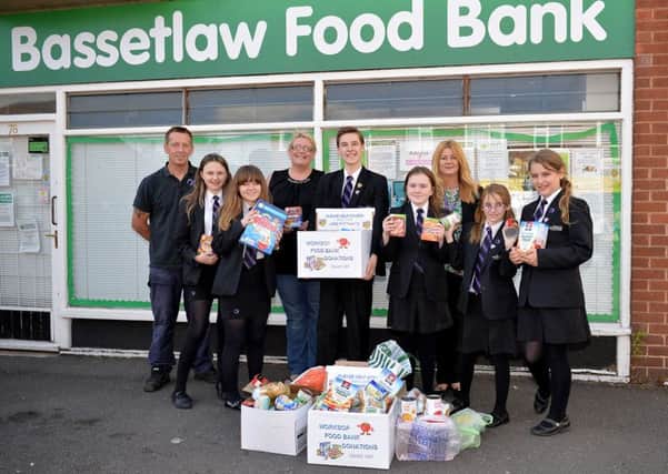 Students of Outwood Academy Valley present food donations they have collected in school to Alison Palmer, pictured are Mr Peace and Mrs Hind with students Oliver Spacey, Jade Gordon, Natalie Franklin, Chontelle Sandford, Katie Holloway and Imogen Galloway-Dutton