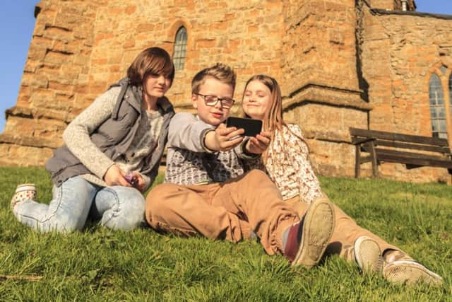 Ella (12), Harry (11) and Natasha (10) get snapping for the West Lindsey Photo Competition 2015 up at the Ramblers Church, Walesby.