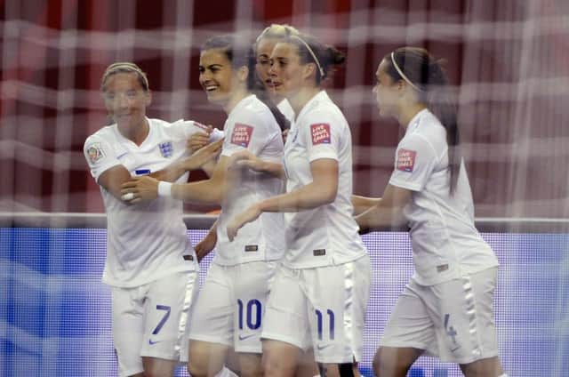England's Jordan Nobbs, from left, celebrates with teammates Karen Carney, Jade Moore and Fara Williams after Carney's goal against Colombia during the first half of a FIFA Women's World Cup soccer match, Wednesday, June 17, 2015, in Montreal, Canada. (Paul Chiasson/The Canadian Press via AP) MANDATORY CREDIT