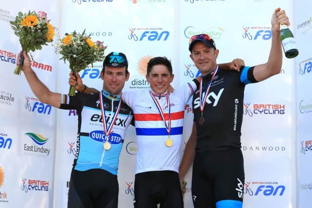 Team Sky's Pater Kennaugh (centre) celebrates winning the the British Cycling National Road Championships in Lincolnshire, along side second placed Etixx - QuickStep Mark Cavendish MBE (left) and thrid placed Team Sky's Ian Stannard. Photo credit: Nigel French/PA Wire