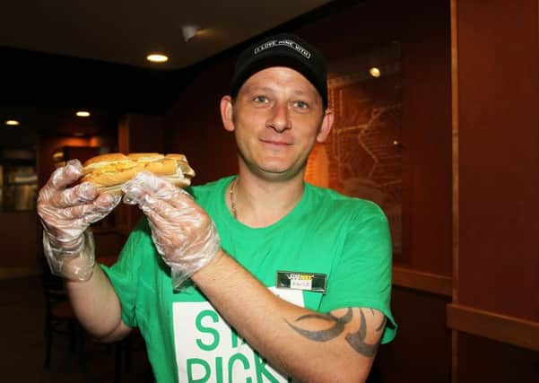 Guardian freebie offer of a free breakfast sub at Subway on Bridge Place. Pictured is Marcus Donnor with the free sub.