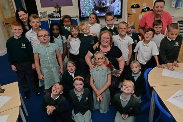 Guardian Rose presentation to Sparken Hill Academy teacher Ann Naylor, Ann is pictured with her class