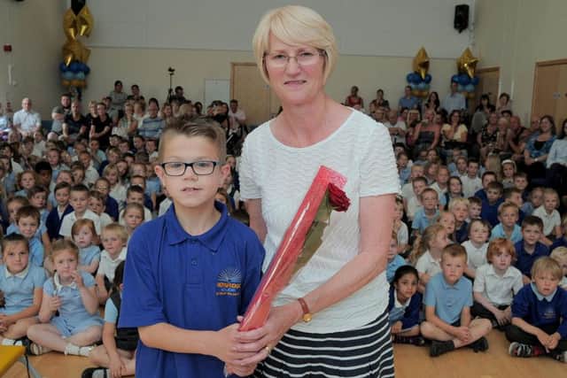 Josh Turner (11), surprised his 'One to One' support teacher Dawn Harrison, with the presentation of a Guardian Rose..
The Rose handover took place at Josh's school 'Norbridge Academy, Worksop.
Dawn has looked after Josh at the school, since he was three years old.
Both are leaving Norbridge at the end of term.
NWGU 16-7-15 Dawns Rose, Dawn Harrison receiving her Guardian Rose from 11 year old Josh Turner, at Norbridge school ( 1 to 4)