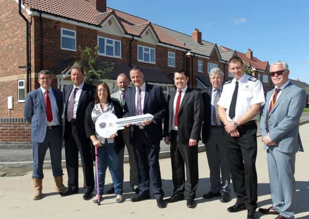 The official opening of the new housing project Smith Square by A1 Hosuing in Harworth. Sarah Cartlidge is pictured in front of her new home with councillors and team members.
