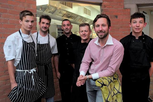 The New Spencers Restaurant in Retford Market Square, on the site of the former Henry Spencer Auction house, has opened its doors to the public.
Almost £1 million has been spent refurbishing the premises to its former glory, including stylish Chandeliers, a feature is the Theatre style Kitchen, enabling customers to see the Chefs at work.
NWGU 30-7-15 Spencers, Proprietor Charles Johnson (front) with Chef line up of Antony Pettet, Head Chef Rob Jessop from TV's River Cottage, Chris Taylor, Dion Titmarsh, Harry Roberts, (5