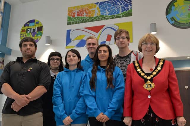 Coun Sybil Fielding pictured with students from North Notts College and their artwork in Worksop Bus Station, pictured are course tutor Dave Davis, Rebecca Lister, Vicky Blemenou, William Storer, Shannon Rose, Piotr Pisorski and Coun Fielding