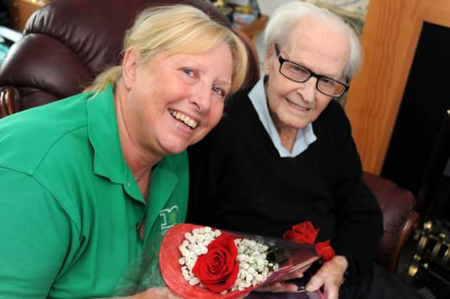 Charles Green presents Sheila Cunnington with her Guardian Rose.