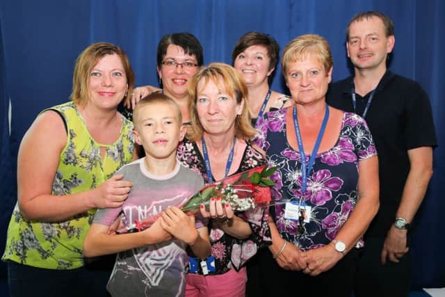 Guardian Rose St Augustine's Primary School L>R Mrs Parsons, Mrs Houghton, Mrs Blades, Mr Kelly FRONT L>R James Parsons age 11, Mel Sanderson, Tracey Howard