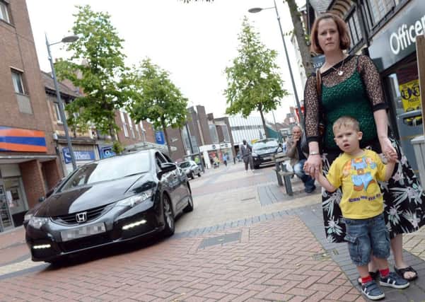 Emma Gunn with her son Zackery, three, who nearly got hit by a car on Bridge Place, Worksop.