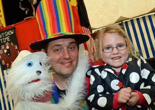 Mr Magic pictured with Lowri Smith, five, of Epworth.