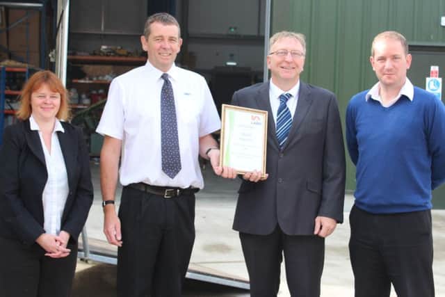 Technical Administrator Jodi Wray, director at OBAM Pete Morely, Senior Building Control Surveyor Trevor Durant and OBAMs company sales manager Martin Buckley celebrate their recent partnership.
