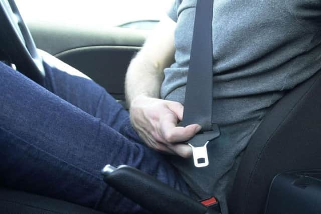 File photo dated 24/08/03 of a driver using his seatbelt. PRESS ASSOCIATION Photo. Issue date: Friday August 31, 2008. Hunchbacks, dwarves and even "irrational objections" from the elderly helped delay the introduction of compulsory seatbelts by more than 10 years, secret documents reveal today. See PA story RECORDS Belt. Photo credit should read: Haydn West/PA Wire