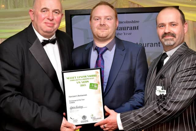Coun Colin Davies presents award to Peter Storey, Head Chef and Lee Martin, Restaurant Manager