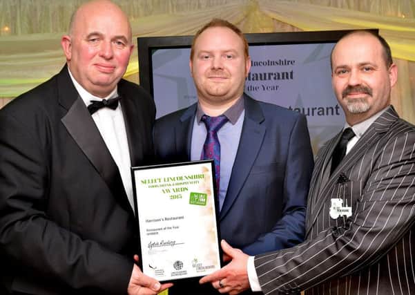 Coun Colin Davies presents award to Peter Storey, Head Chef and Lee Martin, Restaurant Manager