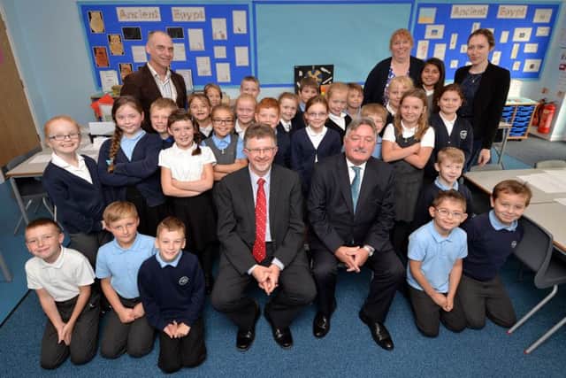 Pictured are Coun Glynn Gilfoyle, Headteacher Chris Guest and Coun Alan Rhodes with pupils and teachers in the school's new classroom