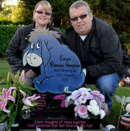 Keith and Emma Hampson with their Daughters headstone which was originally rejected by the council