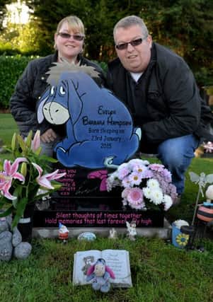 Keith and Emma Hampson with their Daughters headstone which was originally rejected by the council