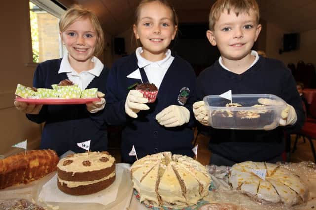 Wroot Travis Primary School children held a Macmillan coffee morning at Wroot Village Hall. Pictured are Daisy Walker, nine, Christy Monument, nine, and Rowen Petch, nine.