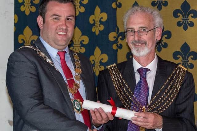 Coun Matt Boles (left), Mayor of Gainsborough, receives a copy of the Mayflower compact during the Mayflower 400 event at the Old Hall