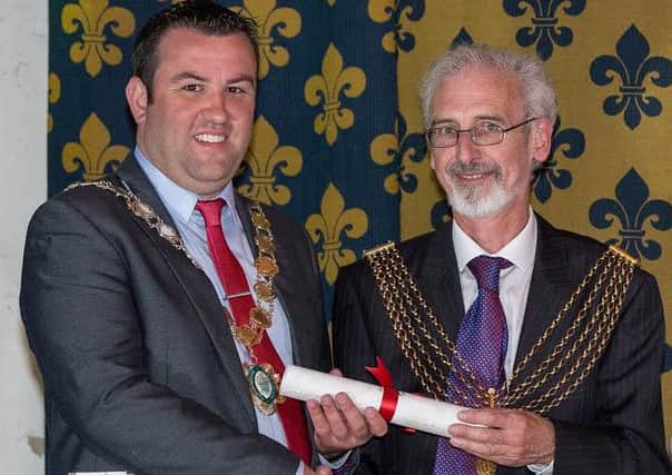 Coun Matt Boles (left), Mayor of Gainsborough, receives a copy of the Mayflower compact during the Mayflower 400 event at the Old Hall