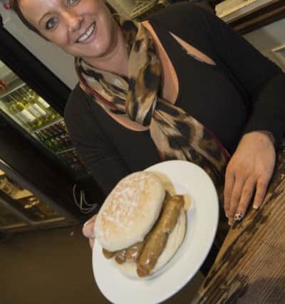 Worksop Gurdian reader offer of a free sausage sandwich held by Natalie Page