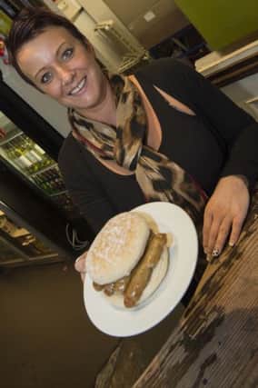 Worksop Gurdian reader offer of a free sausage sandwich held by Natalie Page