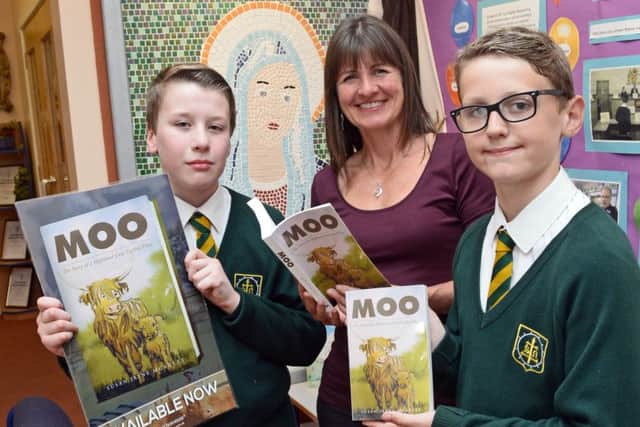 Author Susan McAuley, pictured with l-r Nicky Colebrook and Oscar Hill, both ten. Picture: Marie Caley NEPB McAuley MC 2