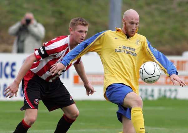 Stocksbridge vs Sheffield Utd.
Sheff Utd,s Skipper Chris Robertson keeper a close eye on Stocksbridge,s Stefan Zoll