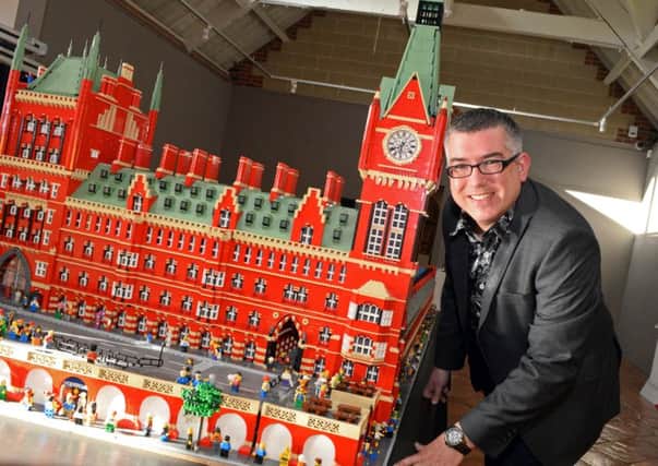Lego Masterbuider Warren Elsmore pictured by his St. Pancras Station creation, which took over two years to make and includes over 150,000 lego pieces. Picture: Marie Caley NWGU Lego MC 8