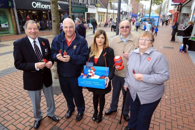 Guardian reporter Sophie Wills selling poppies with the Royal British Legion in Worksop. Pictured with Sophie are David Scott, Peter Hopkins, Maureen Gresham and Harry Gresham.