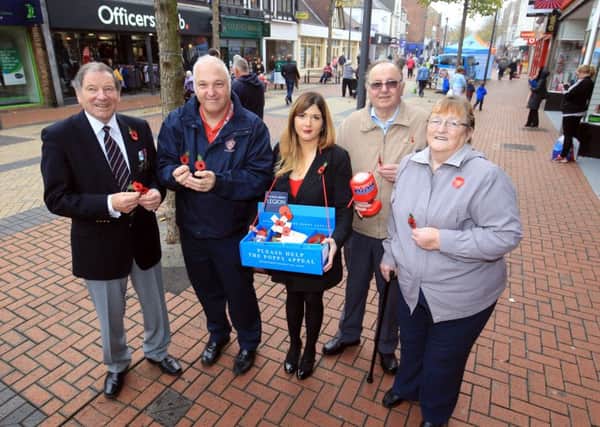 Guardian reporter Sophie Wills selling poppies with the Royal British Legion in Worksop. Pictured with Sophie are David Scott, Peter Hopkins, Maureen Gresham and Harry Gresham.
