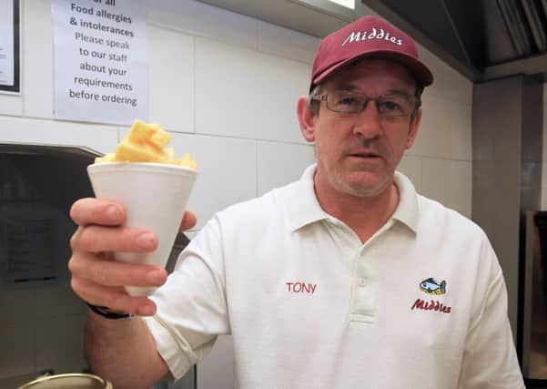 Standard freebie offer of a cone of chips at Middies Fish & Chips on Trinity Street in Gainsborough. Pictured is Tony Wallace.
