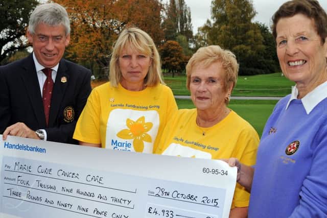 Christine Walker, right, the Lady Captain of 2014 at the Lincoln Golf Club, presents the proceeds of her years' fundraising, totalling £4933.99, to Marie Curie representatives, Anne Looker and Robina Cameron, who nursed Christine's husband Gordon, in whose memory the presentation was made. Also pictured is John Haycox who was Captain during the same year and raised a similar amount for Multiple Sclerosis.