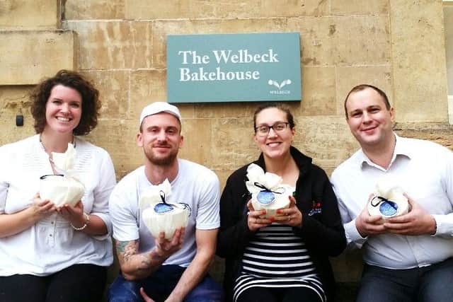 Emma Hall, bakery manager, Rob Taylor, head baker, Claire Monk, head brewer, Oliver Stubbins, farm shop manager, with the Welbeck luxury Christmas puddings.