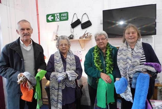 Members of Retford U3A witth items of knitwear they are donating to HOPE