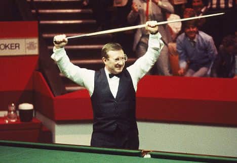 May 1985:  Dennis Taylor of Northern Ireland celebrates victory in the Embassy World Snooker Championship Final at the Crucible Theatre in Sheffield, England. Taylor beat Steve Davis 18-17 in a dramatic black ball finish.Mandatory Credit: Adrian Murrell /Allsport