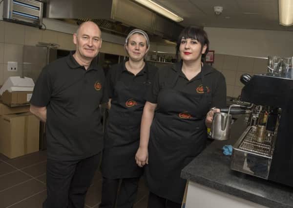 Franchisee Phil McCall with staff members Any Hicket and Amy Harris at the official opening of the Nosh cafe in Worsopâ¬"s Bus Station