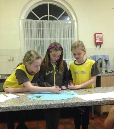 Members of 1st Shireoaks (St Luke's) Brownies creating their spot for Blue Peter's superhero cape world record challenge