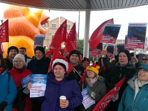 Members of Unite and churches from across the region joined forces outside Sports Direct in Mansfield to protest against 'scrooge like' working conditions