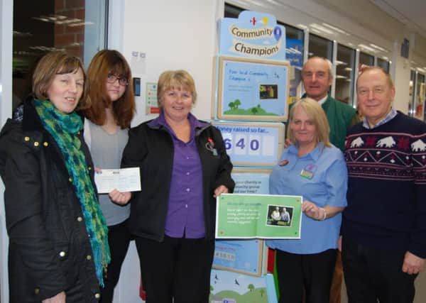 Representatives from Misterton show have been presented with a cheque for Â£640 by Co-op store manager, Brenda Gleadle (centre left) and community liaison representative Caroline Harrop (centre right)